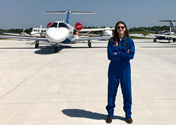 Katie Gross Poses on the Tarmac