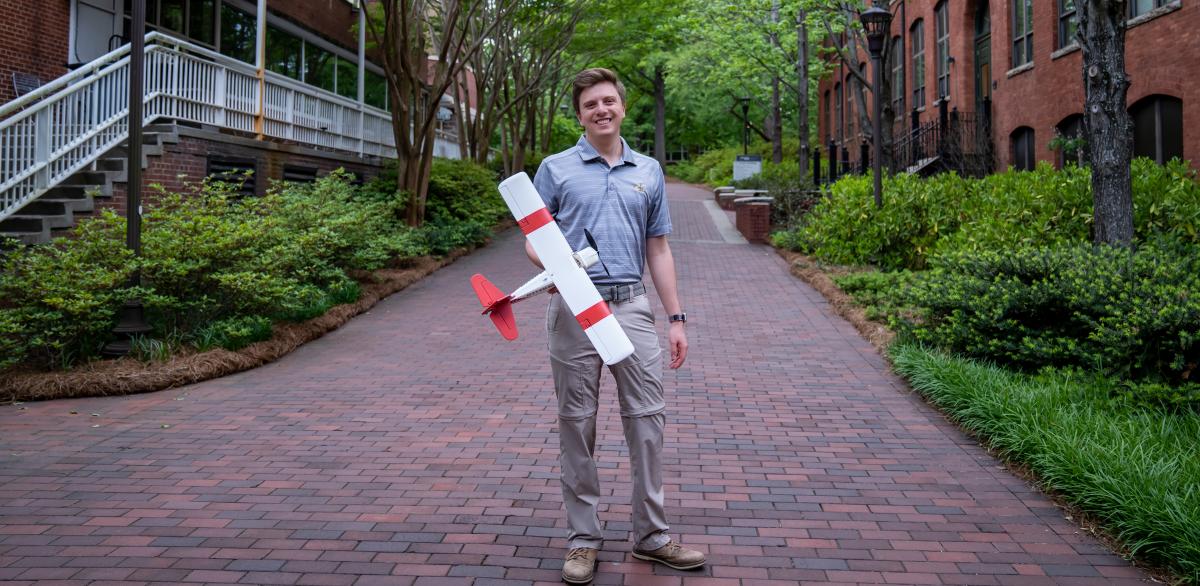 Alexander Lomis holds a small aircraft he built as an aerospace engineering student. Location. Georgia Tech campus in Atlanta Georgia