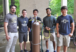 Buzzin' Ballooners pose with their helium tank