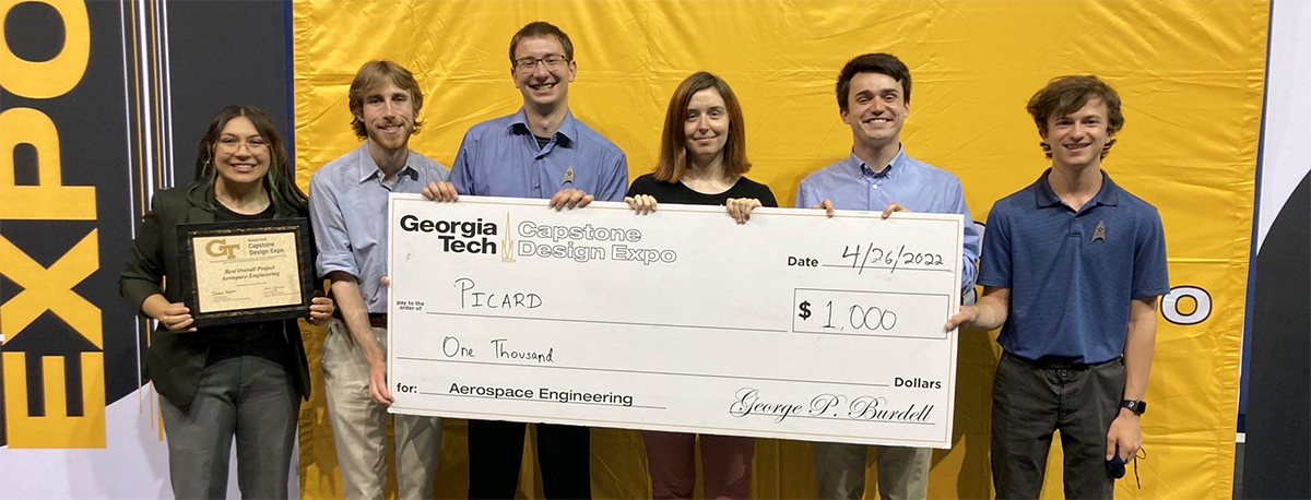 Team PICARD smiles with their huge check in hand after winning the best overall aerospace project at the Spring 2022 Capstone Design Expo