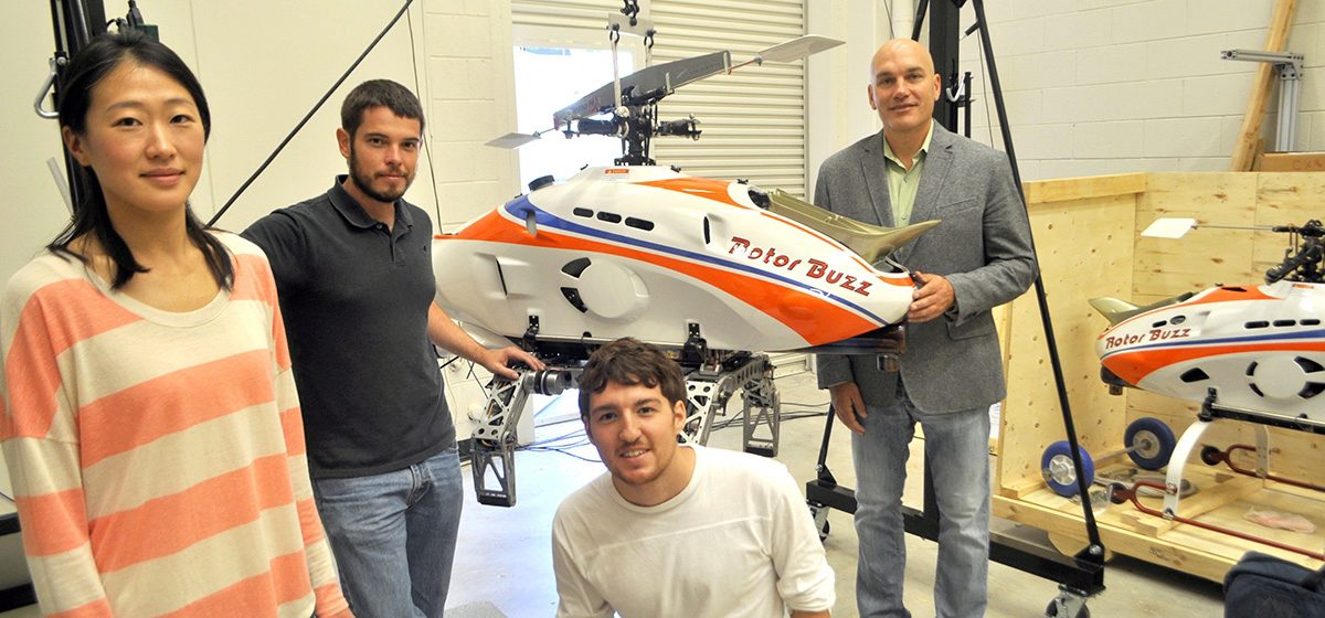 Prof. Costello with four students in his UAV lab
