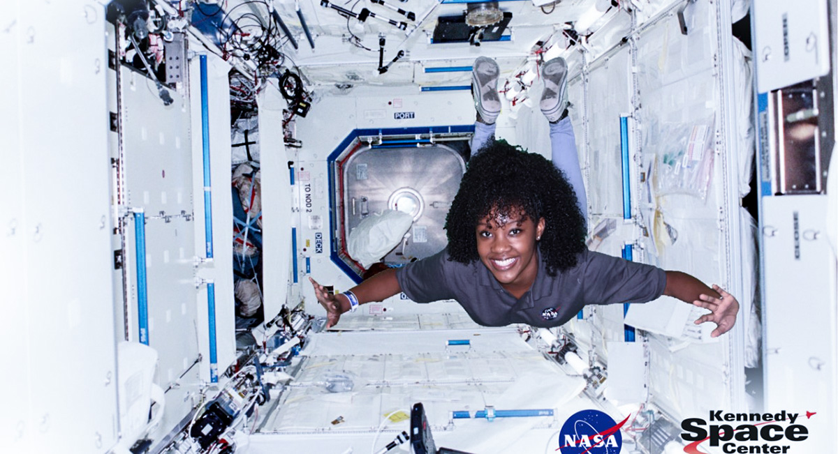 Naia Butler Craig floating in a simulated ISS