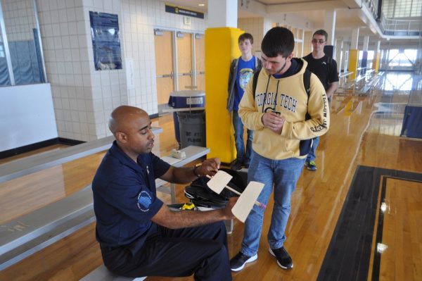 Dr. Ruffin helping a student design a balsa wood prototype glider