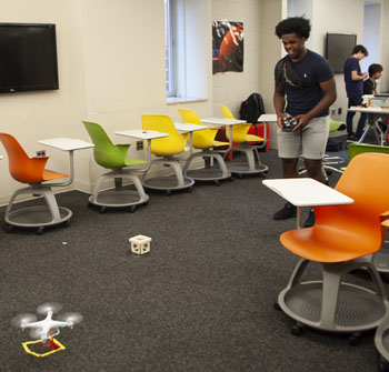 Elijah practicing with piloting the drone before competition