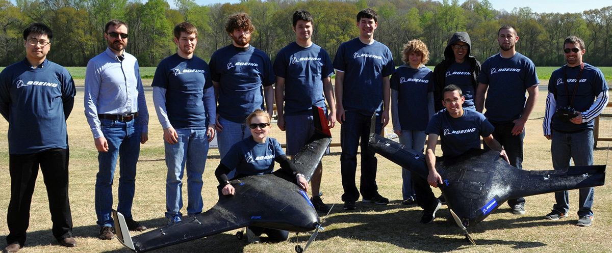 The AE students who competed in the Aerospace Competition in 2014 standing next to the plane they built