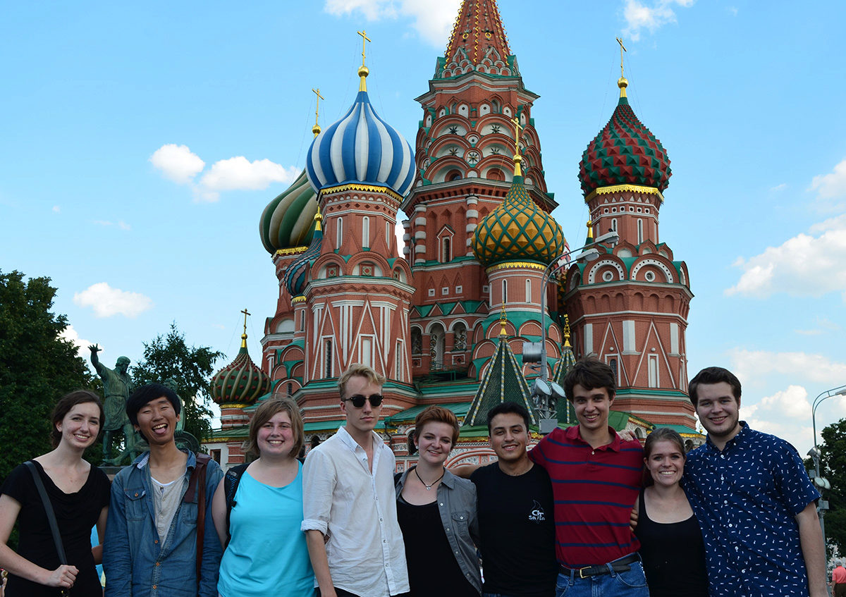 A group of students standing in front of an ornate Russian church