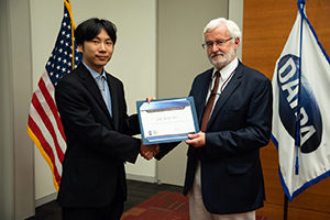 Prof. Koki Ho accepts DARPA award from DARPA program manager Michael Fiddy