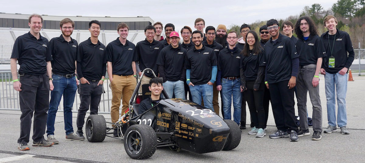 The entire HyTech racing team with their car at the New Hampshire competitin