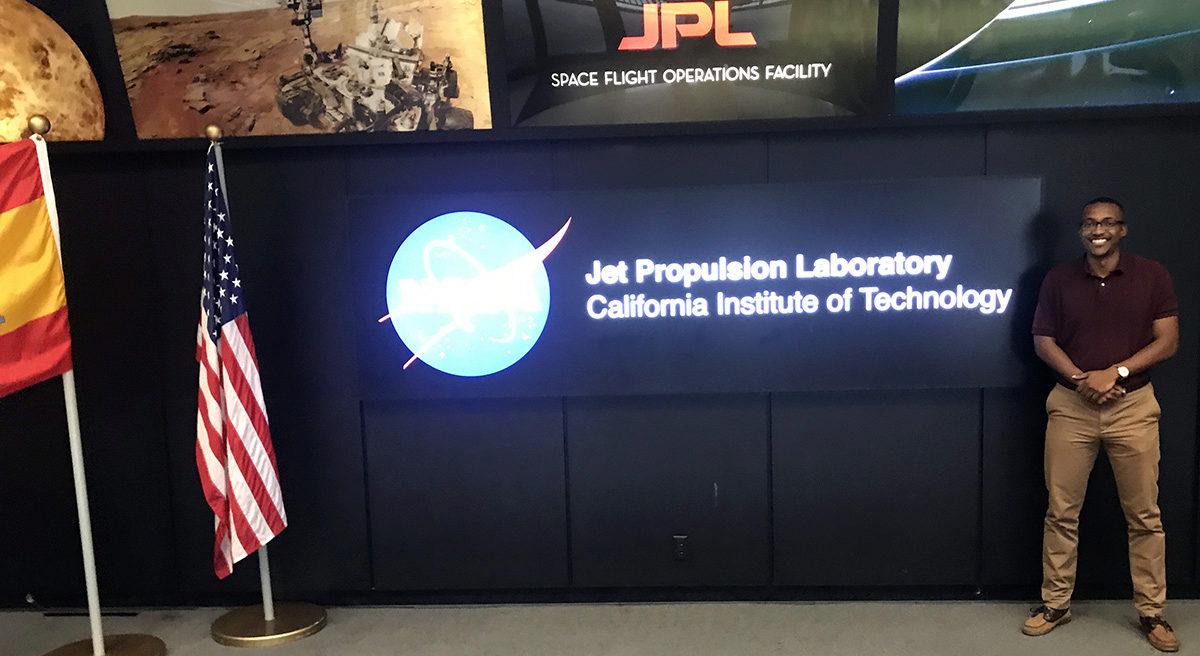Christopher Roper standing in the entryway of the Jet Propulsion Lab