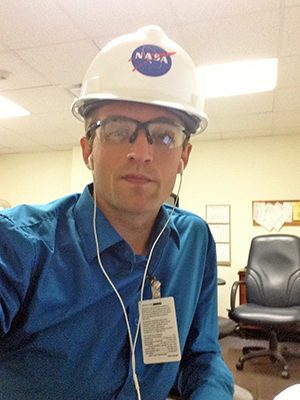 Kenneth Smith wearing NASA safety helmet