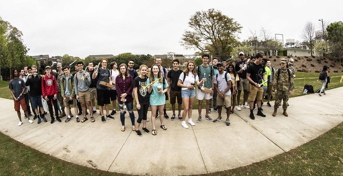 group of students proudly standing with their rockets from AE 1601