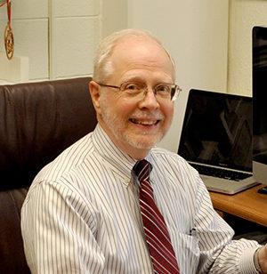 Dewey Hodges at his desk