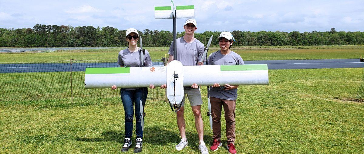 Team S.T.O.R.M. poses with their fixed-wing UAS