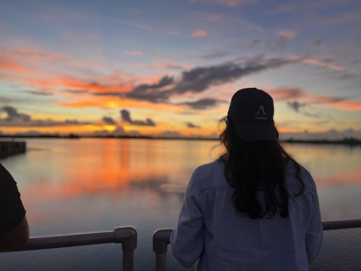 Kelsey Gulledge looks out over the launch site as the sunrises over Cape Canaveral 