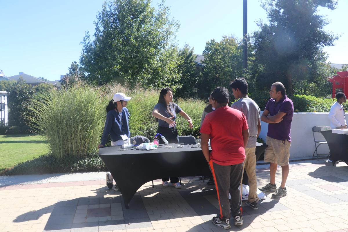 volunteers engaging students at sda