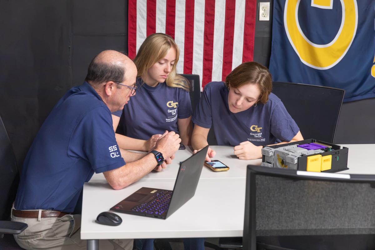 Students talking with Professor Lightsey